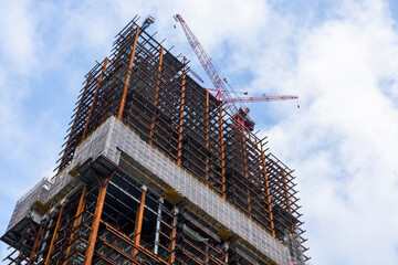 building construction site and cranes with the blue sky background