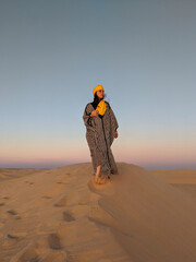 Young girl posing in the desert of Tunisia