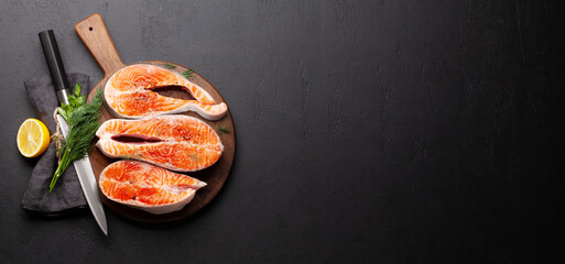 Fresh raw salmon cooking. Fish steaks with herbs and spices