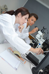 a concentrated young female scientists