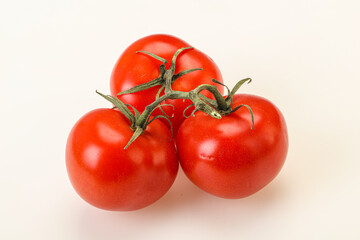 Red bright ripe tomato branch