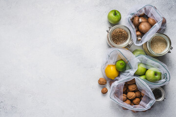 Eco friendly shopping with reusable bags and glass jars. Packaged Healthy Vegan Products. Zero waste and Plastic free shopping. Sustainable lifestyle concept