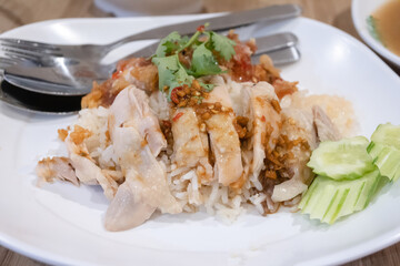 sliced chicken on steamed rice dressing with spicy dip