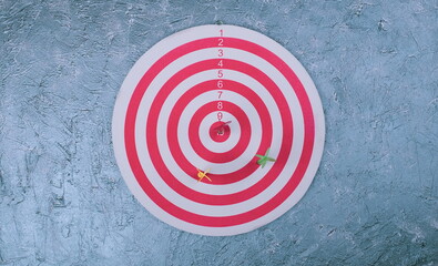 Business and success concept. Hitting in the target. Dartboard and arrow.
