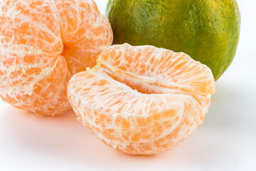 Close-up peeled oranges isolated on a white background