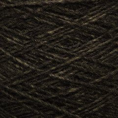 Colored yarn threads black macro