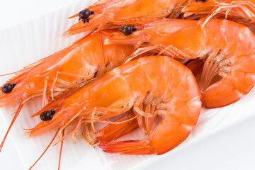 Close-up of fresh boiled shrimp isolated on white background