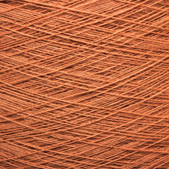 Colored yarn threads orange macro