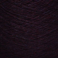 Colored yarn threads black macro