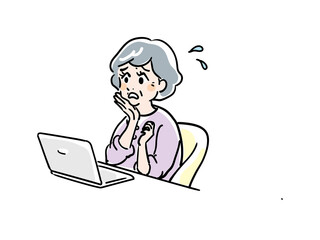 パソコンの使い方に悩むシニア女性
