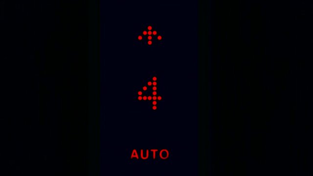 Elevator numbers on a black background. Changing numbers and a moving elevator panel to different floors in a high-rise building.