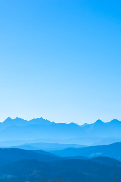 Blue surreal mountains against the backdrop of a cyan sky, fantastic fairytale mountain landscape