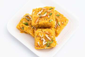 Sindhi Indian Mithai Sev Badam Halwa Burfi Barfee Or Barfi Is Made Of Bengal Gram Flour Besan Kaju Kesar Pista Khoya Meetha Doodh Mawa Malai In Desi Ghee. Isolated On White Background With Copy Space