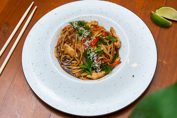 Traditional asian noodles with chicken meat