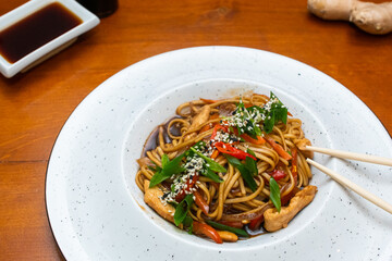 Traditional asian noodles with chicken meat