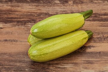 Young tasty zucchini over board