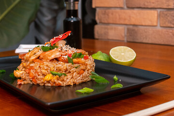 fried rice with shrimp, asian food on wooden table