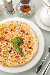 Khachapuri on a white table

