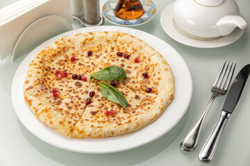 Khachapuri on a white table

