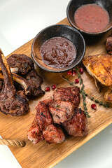 grilled meat on a large cooking board
