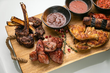 grilled meat on a large cooking board
