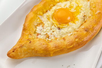 Khachapuri on a white table

