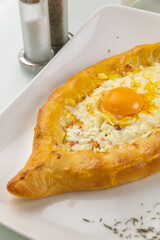 Khachapuri on a white table
