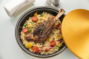 grilled meat on a plate with garnish
