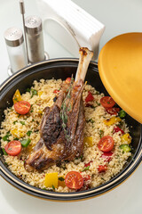 grilled meat on a plate with garnish
