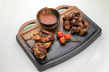 grilled meat on a large cooking board
