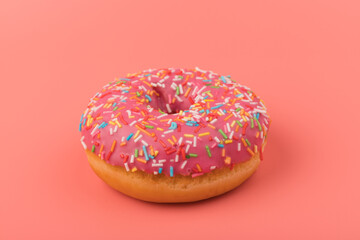 Fresh made Donuts isolated on pink background. Doughnuts are traditional sweet pastries. Copy space for text.