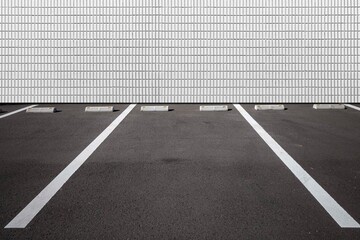 Empty outdoor car Parking Spaces and concrete wall