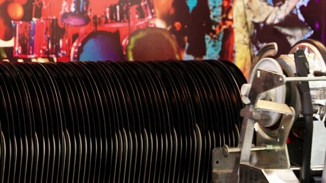 Wonderful slow motion shot Jukebox playing vinyl single. Record ends classic mechanism first set record back and goes left side and back start position.