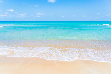 Beautiful tropical beach sea ocean with white cloud and blue sky