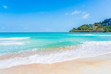 Beautiful tropical beach sea ocean with white cloud and blue sky