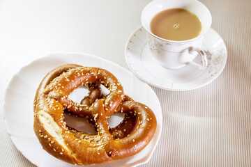 Breakfast with delicious pastries and coffee with cream