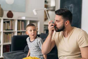 man using asthma pump at home