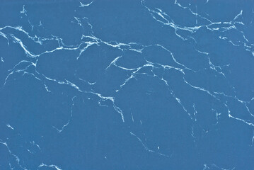 Texture of blue marble. Stone tile with natural pattern. Marble pavement closeup.