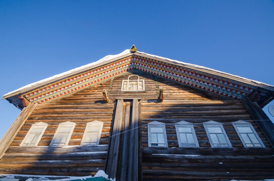 February, 2021 - Kilts. An old residential peasant house with a painted roof and pediment. Russia, Arkhangelsk region, Mezensky district, Kiltsa village 