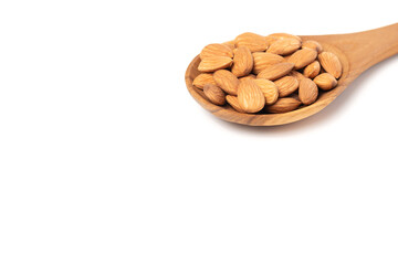 Almond seeds in the wooden spoon. No clipping path.