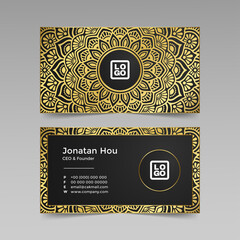 Golden mandala with business card on dark background