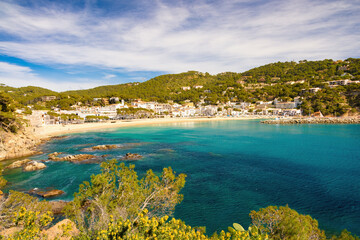 Obraz premium Panoramic view of the bay of Llafranc with the town center in the background. Palafrugell, Catalonia, Spain