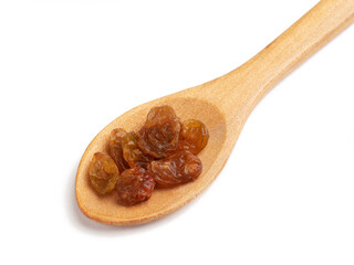 Raisins in wooden spoon on white