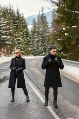 couple walking on the car road