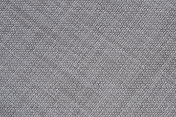 Beige mat of dry wicker fiber as texture, background.