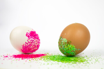 Easter eggs in bright sparkles on a white background.