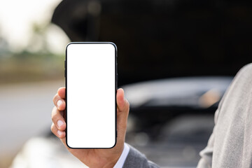 Blank screen of smartphone. Young businessman holding smartphone using application to call service and help car was broken down.