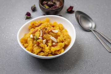 Moong Dal Halwa or Mung Daal Halva is an Indian dessert recipe, made with mung lentil, clarified butter and sugar, garnished with dry fruits