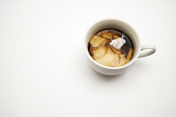 Cup of coffee with milk on white background