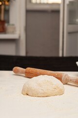 Preparation of the dough for pizza. Hands prepare the dough